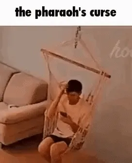 GIF of sand pouring down on a man's head with the caption 'the pharaoh's curse'